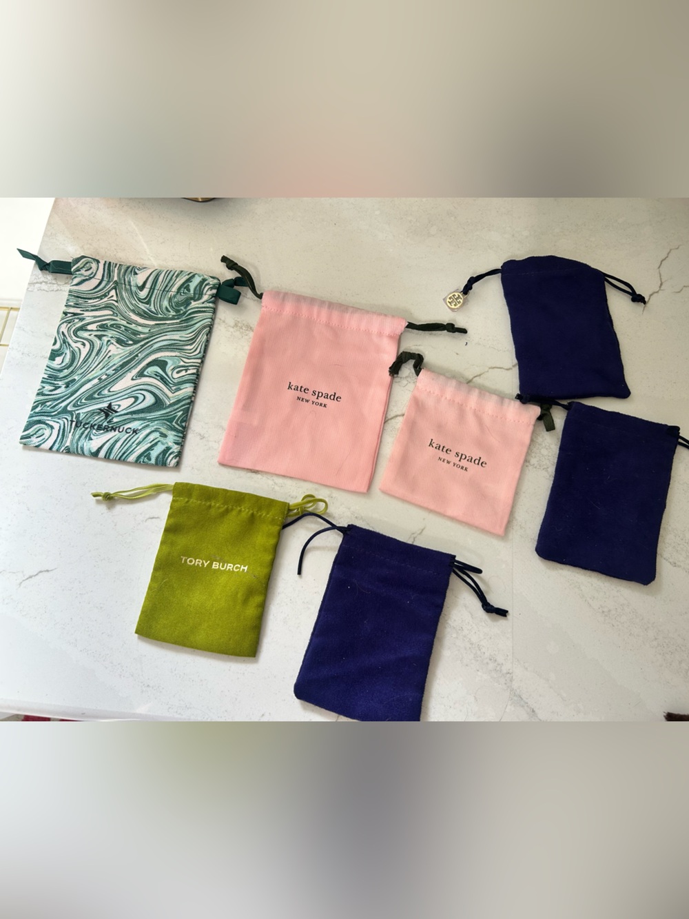 Set of 7 jewelry dust bags- Kate Spade, Tory Burch, and Tuckernuck